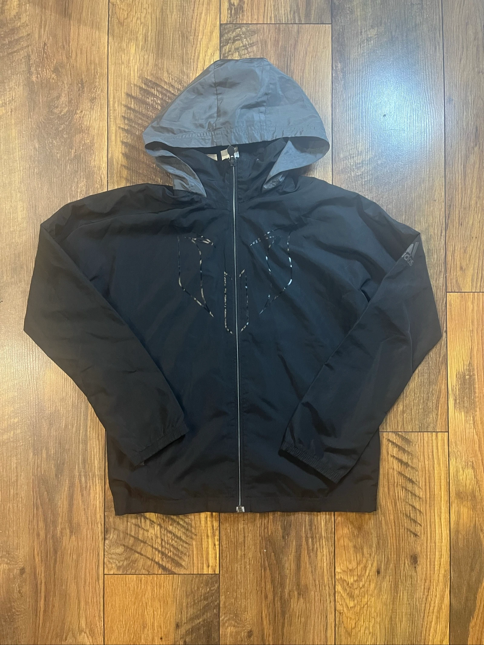Veste coupe-vent noire capuche logo réfléchissant collab Messi - Adidas - 12 ans - très bon état 